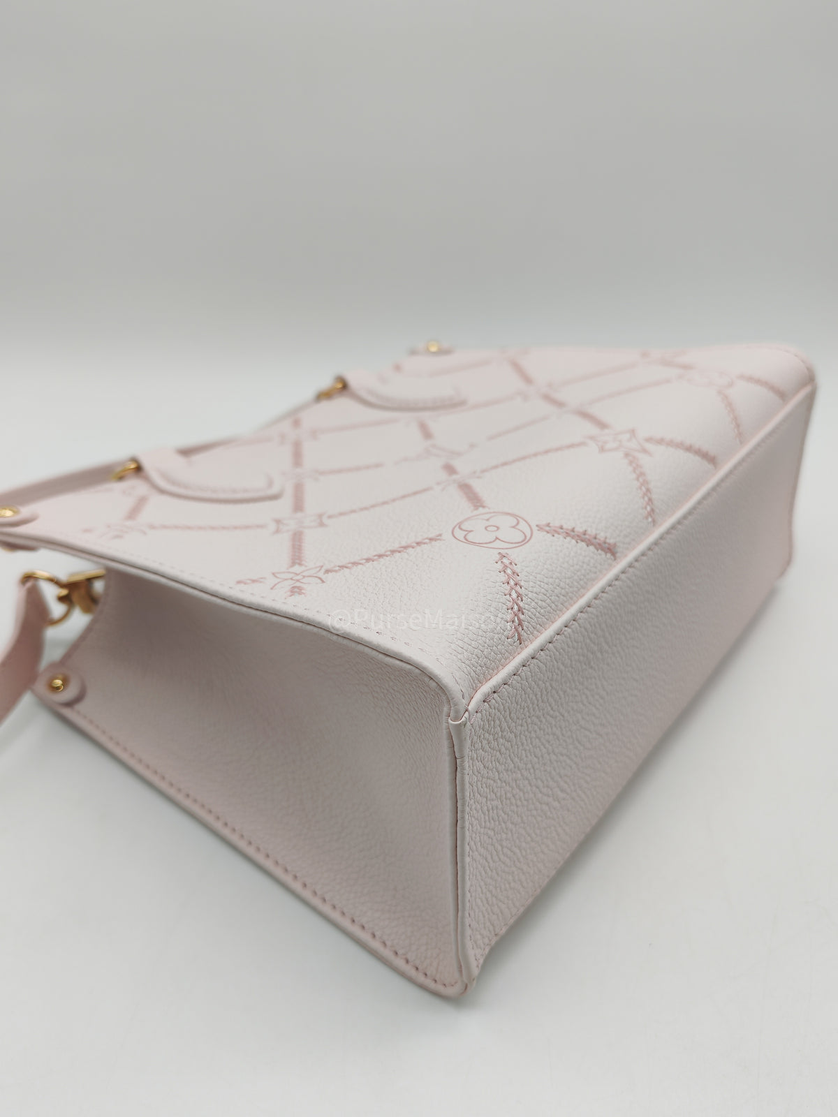 Louis Vuitton OnTheGo PM in Pale Pink Monogram Empreinte Couture Cowhide Leather and Gold Hardware Microchip