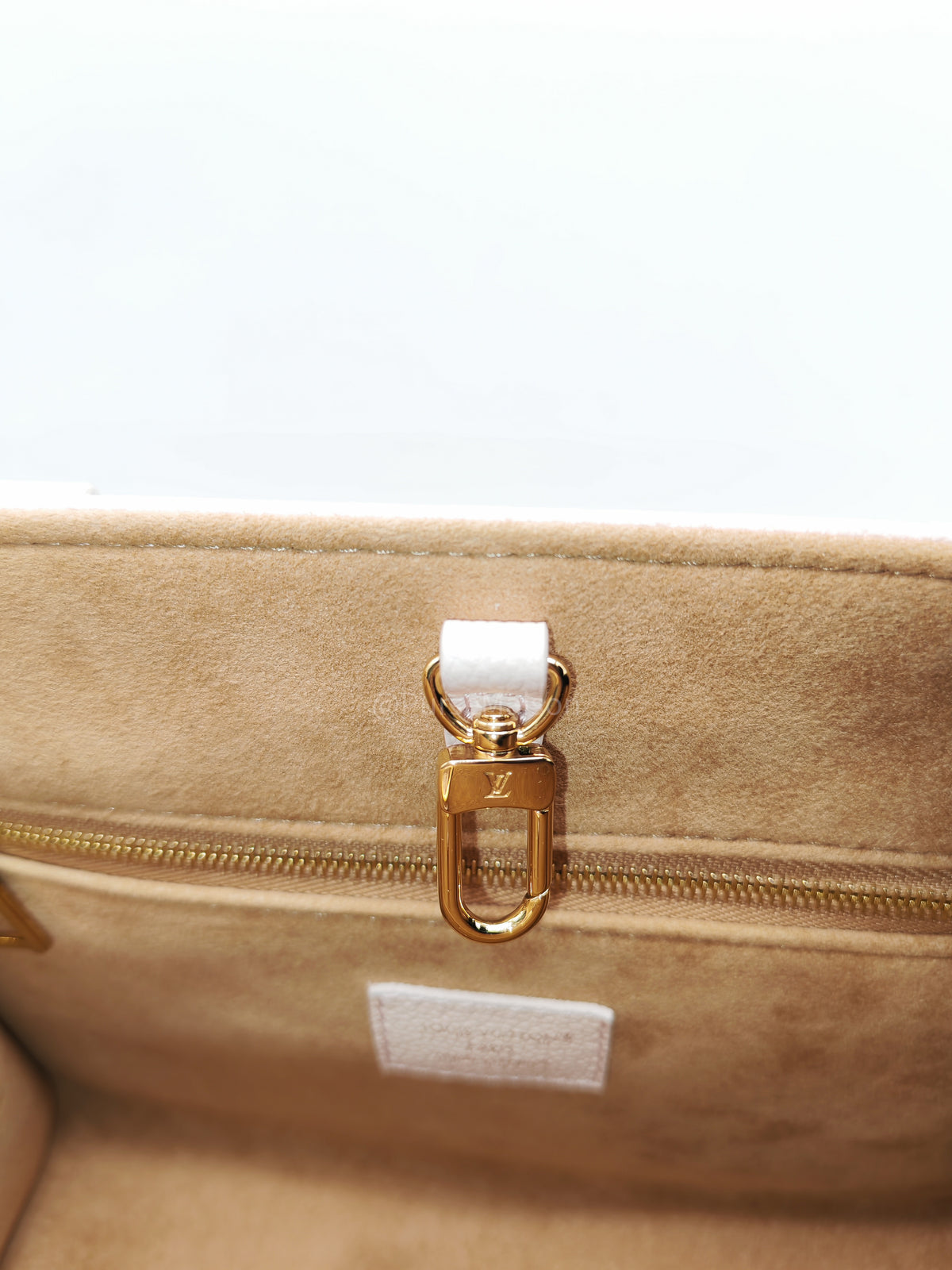 Louis Vuitton OnTheGo PM in Pale Pink Monogram Empreinte Couture Cowhide Leather and Gold Hardware Microchip