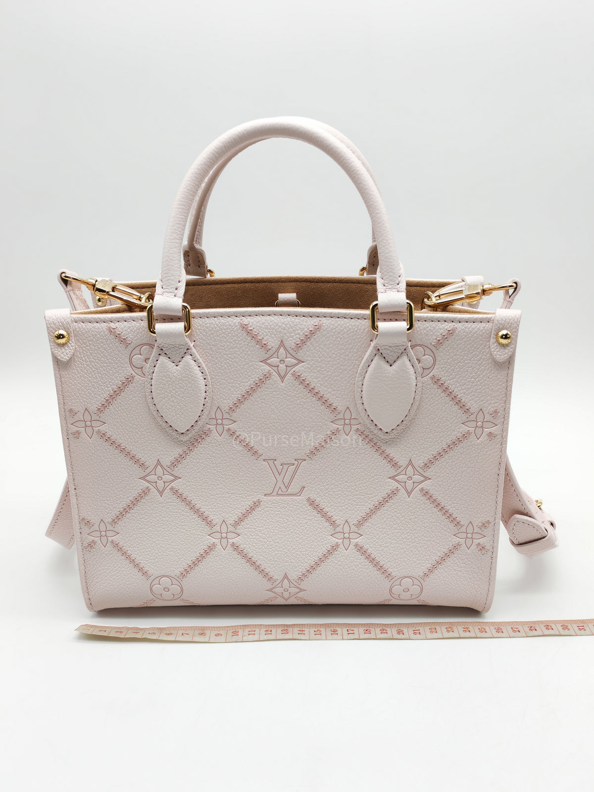 Louis Vuitton OnTheGo PM in Pale Pink Monogram Empreinte Couture Cowhide Leather and Gold Hardware Microchip