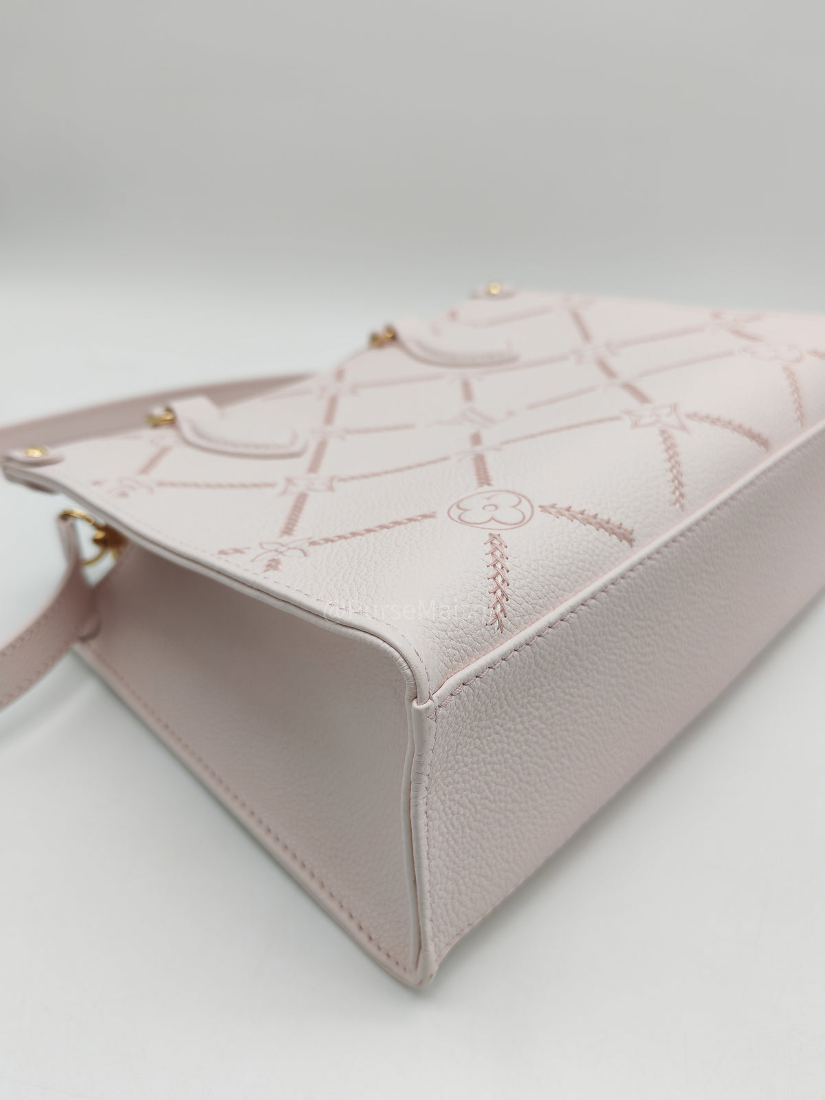 Louis Vuitton OnTheGo PM in Pale Pink Monogram Empreinte Couture Cowhide Leather and Gold Hardware Microchip