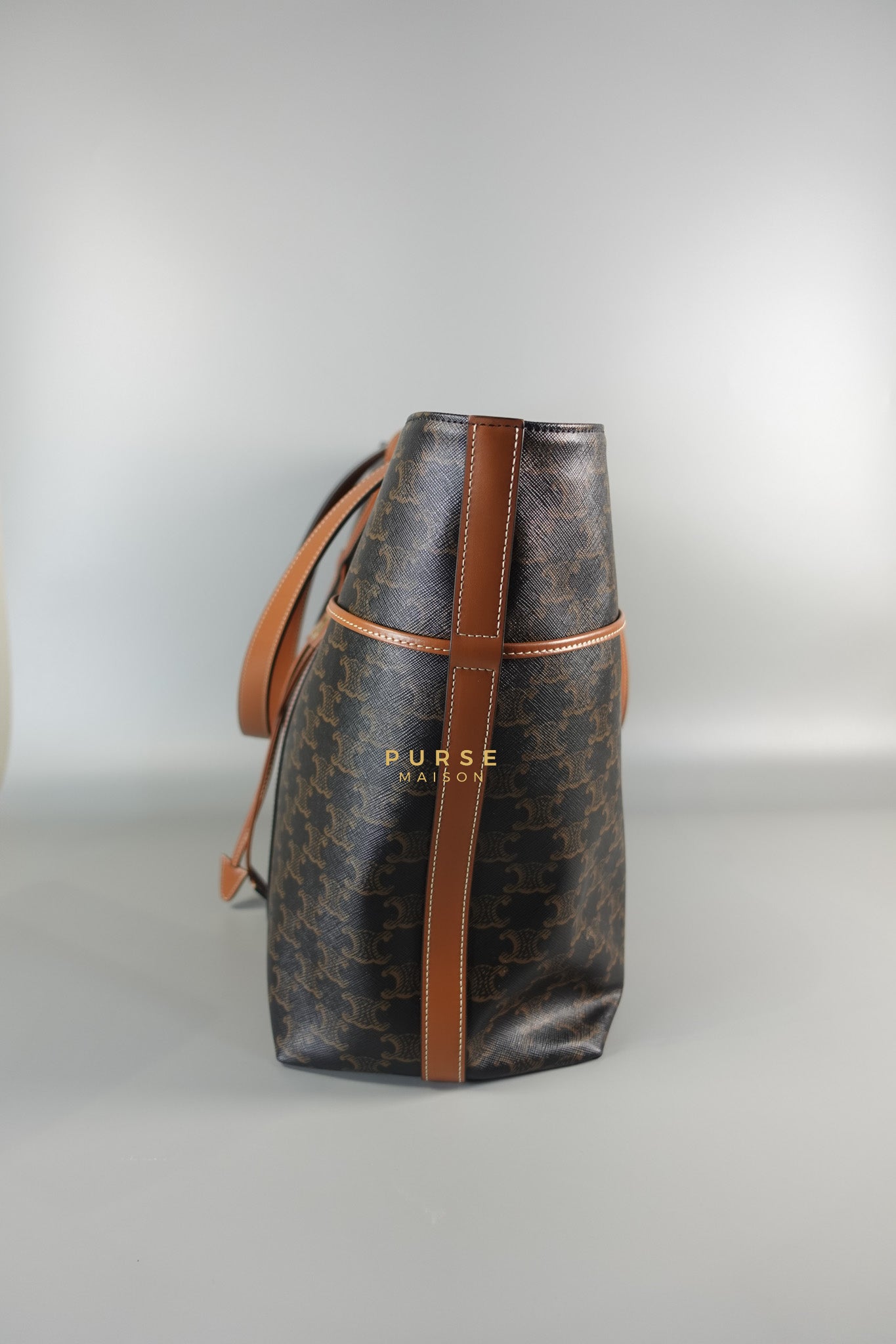 Cabas Drawstring in Triomphe Canvas and Calfskin Leather |