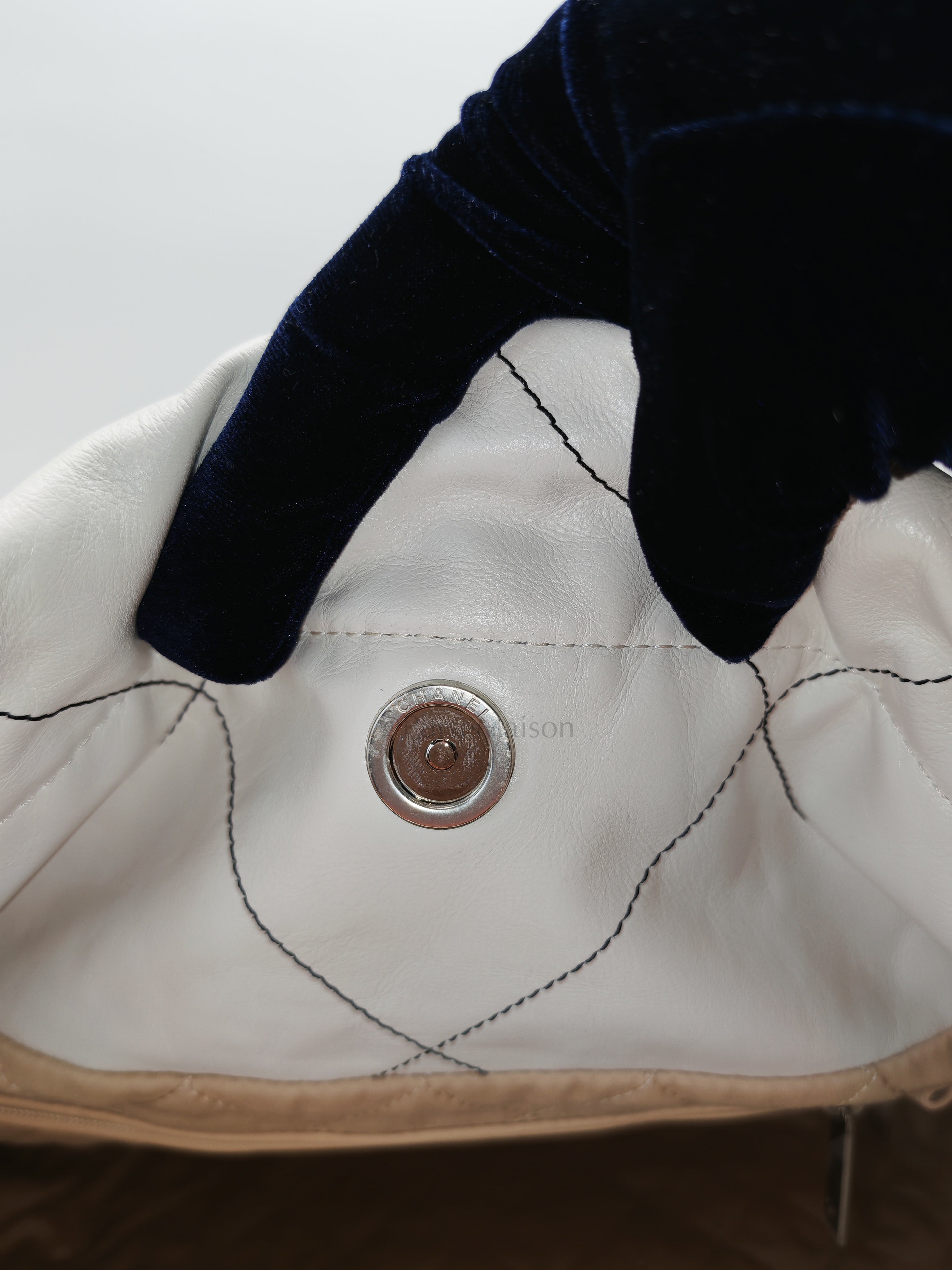 22 in White Quilted Calfskin Leather & Silver Hardware Microchip | Purse Maison Luxury Bags Shop