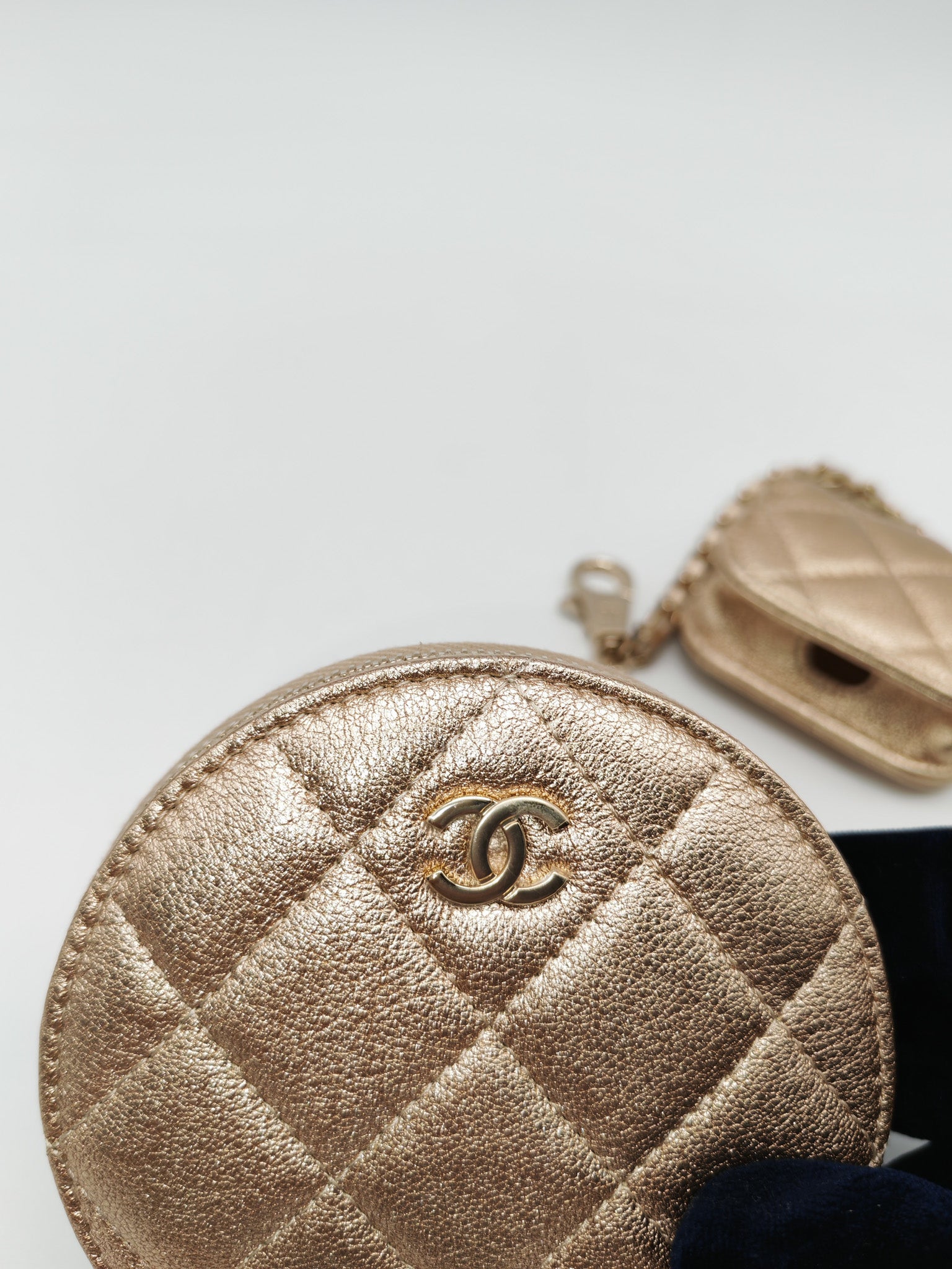 Chanel Round Clip-on Coin Purse and Airpods Case Set in Metallic Gold Quilted Lambskin Leather and Light Gold Hardware Microchip | Purse Maison Luxury Bags Shop