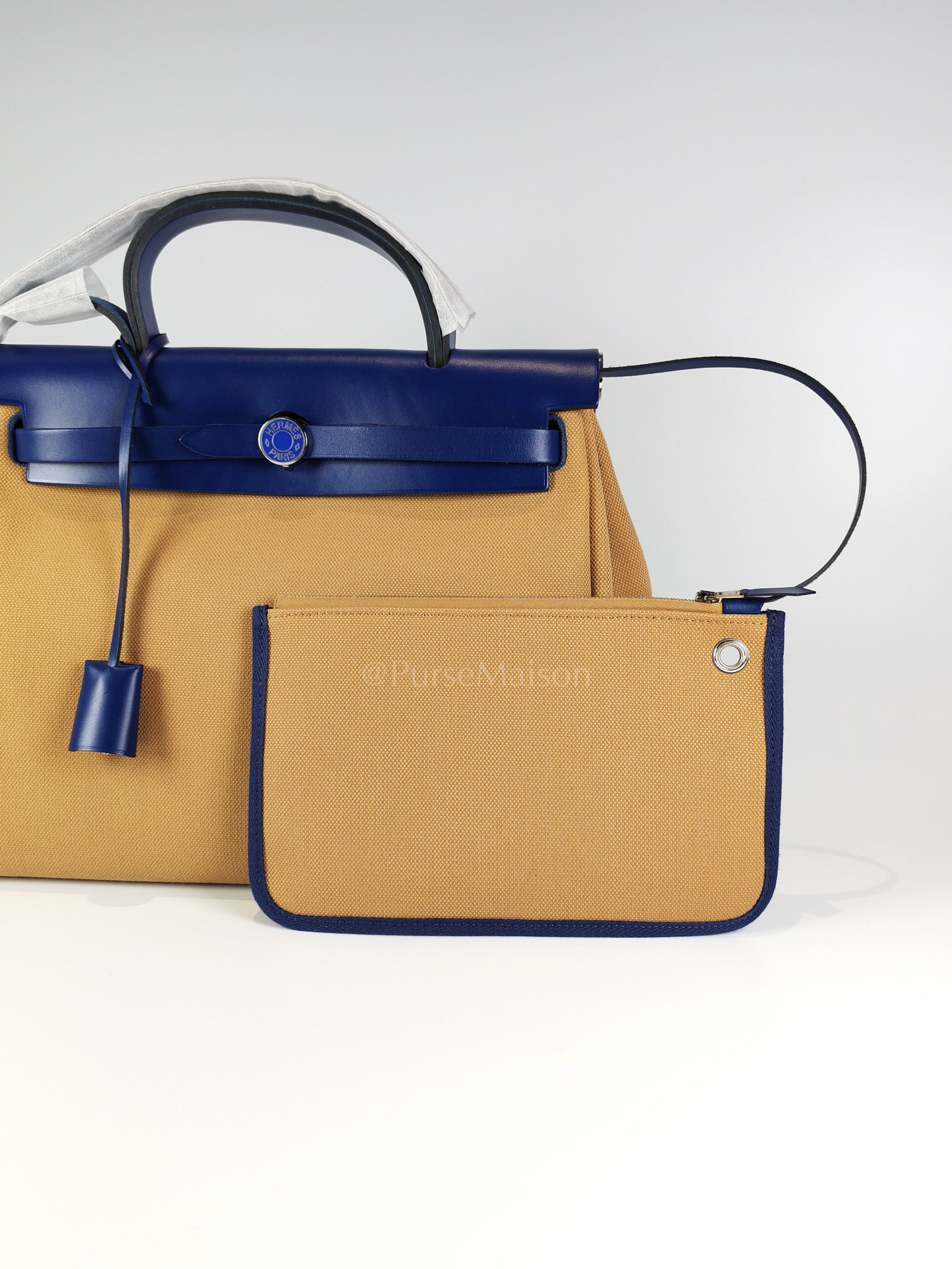 Herbag 31 Retourne in Blue Saphire Leather and Beige Canvas Stamp U (2022) | Purse Maison Luxury Bags Shop