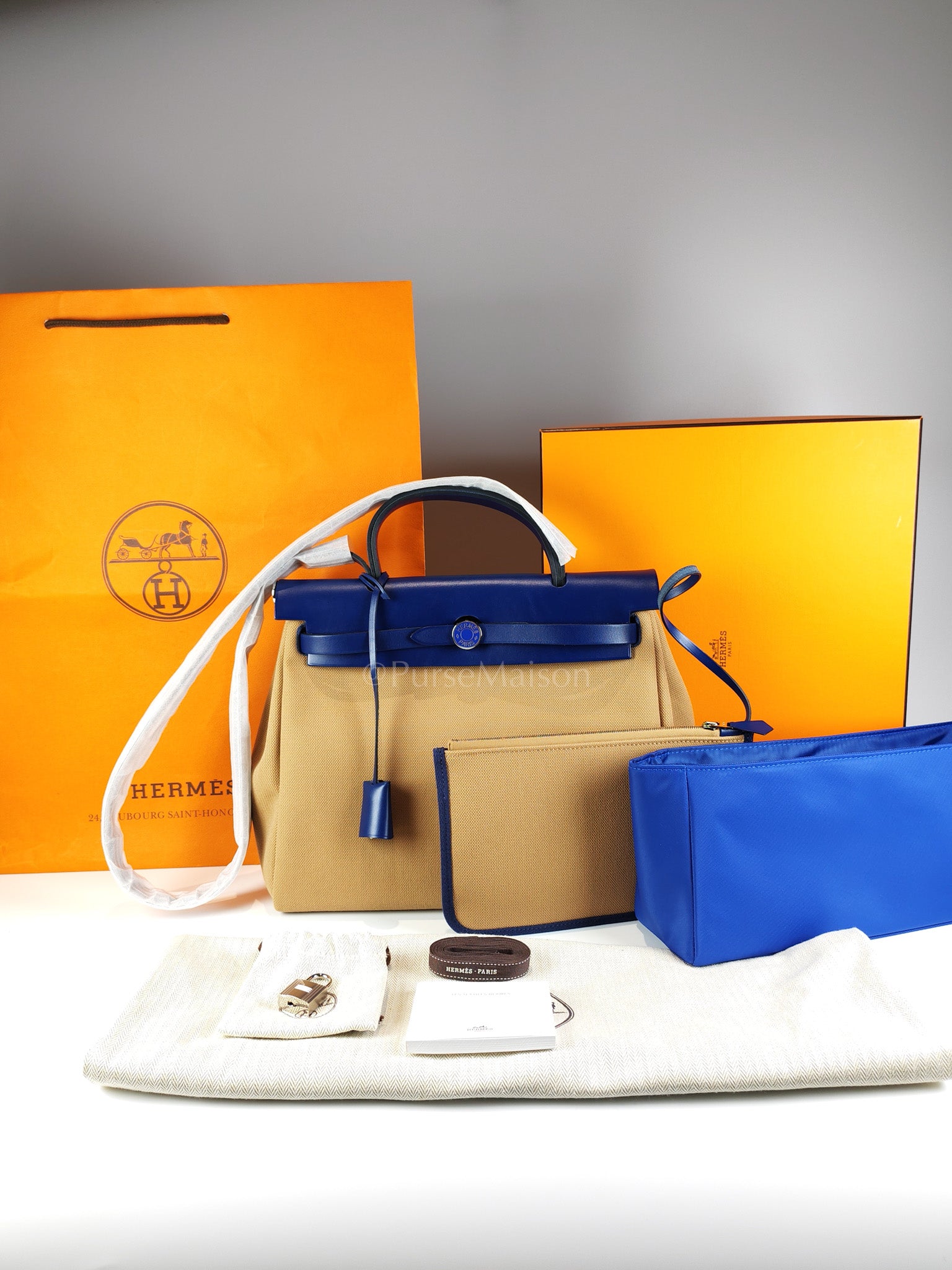 Herbag 31 Retourne in Blue Saphire Leather and Beige Canvas Stamp U (2022) | Purse Maison Luxury Bags Shop