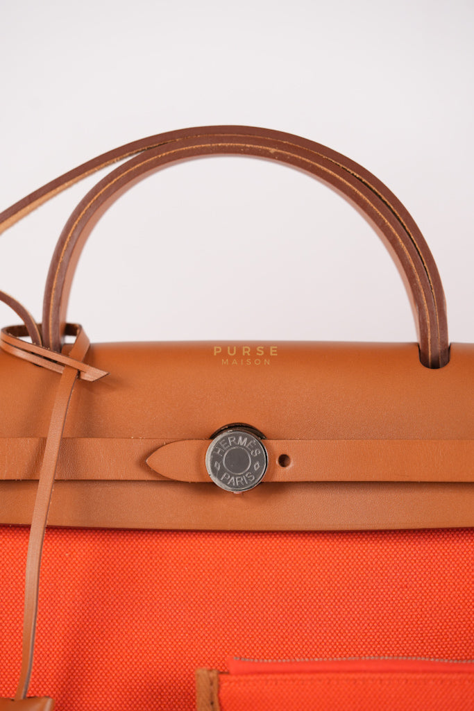 Herbag Zip 31 Capucine Toile H Berline Vache Fauve Hunter Naturel Palladium Hardware Stamp B (2023) | Purse Maison Luxury Bags Shop