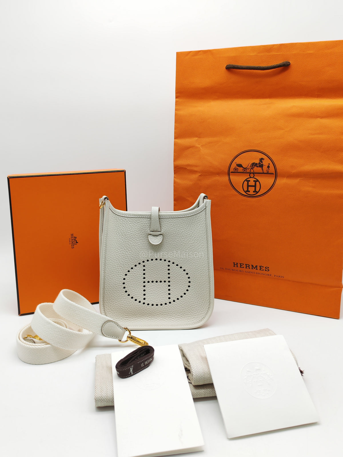 Hermes Mini Evelyne 16 TPM in Craie Clemence Leather and Gold Hardware Stamp W (2024) | Purse Maison Luxury Bags Shop