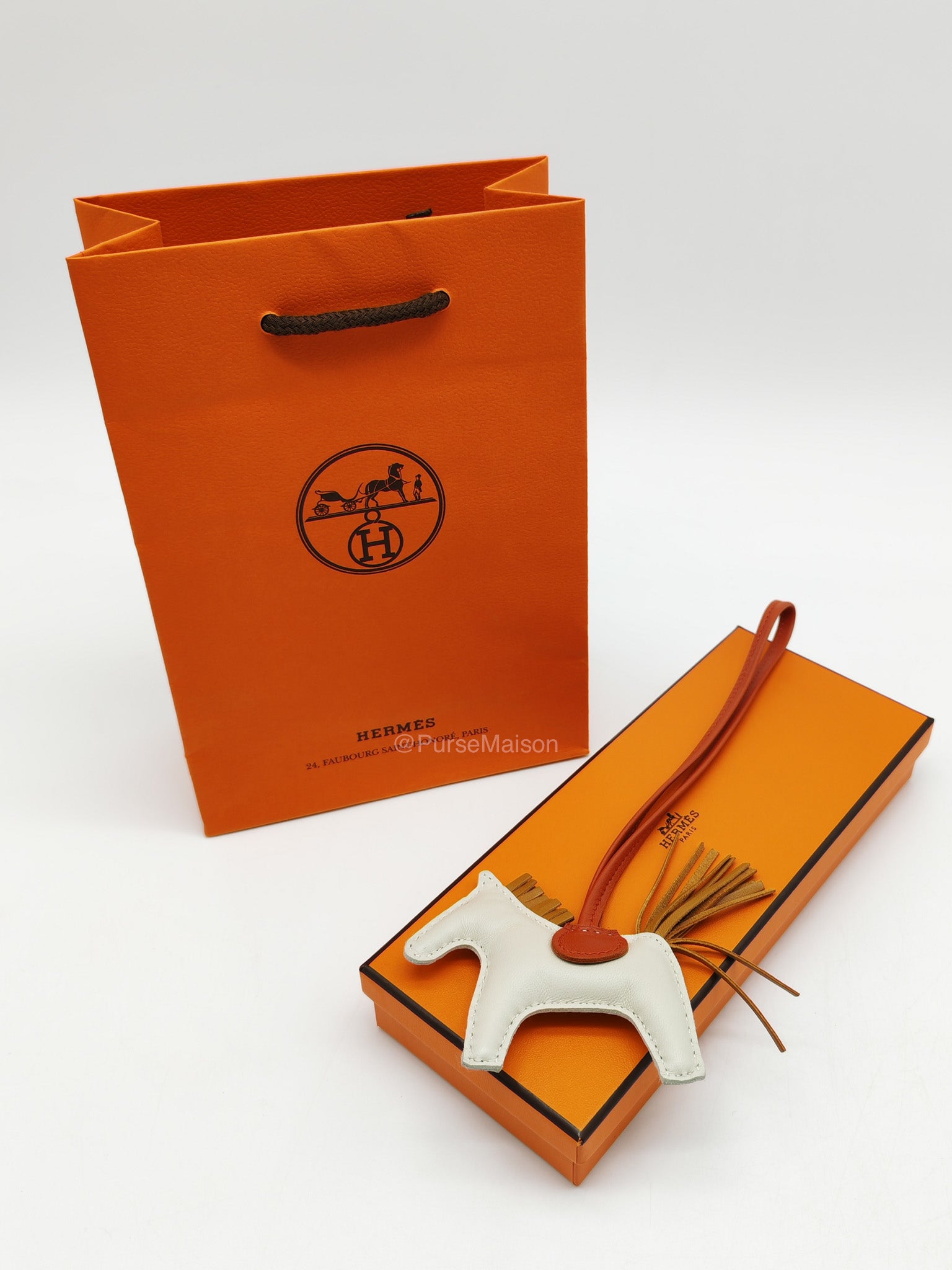 Hermes Rodeo Horse Bag Charm PM in Craie/Sesame/Cornaline Milo Lambskin Grigri Leather | Purse Maison Luxury Bags Shop