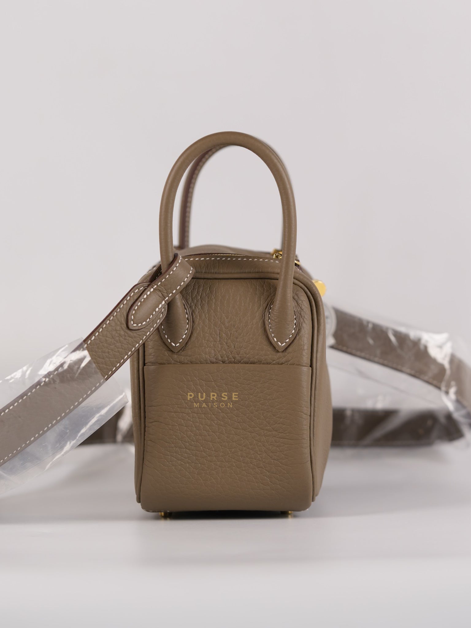 Mini Lindy Etoupe in Taurillion Clemence Leather and Gold Hardware Stamp W (2024) | Purse Maison Luxury Bags Shop