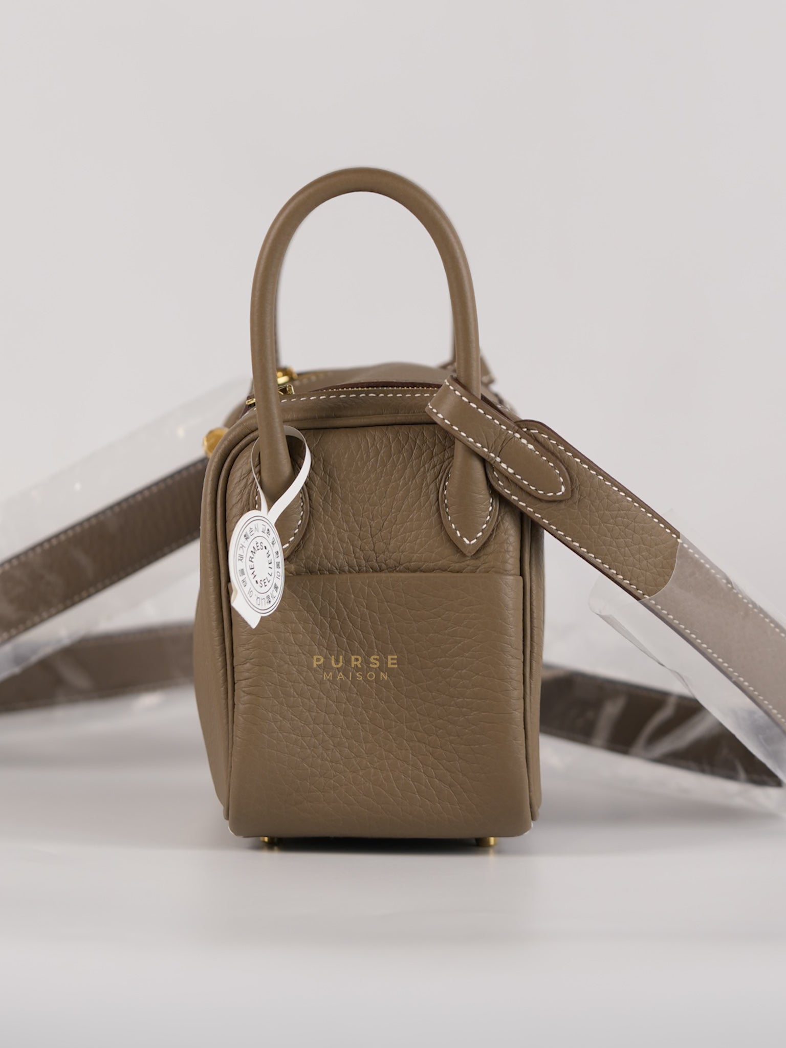 Mini Lindy Etoupe in Taurillion Clemence Leather and Gold Hardware Stamp W (2024) | Purse Maison Luxury Bags Shop