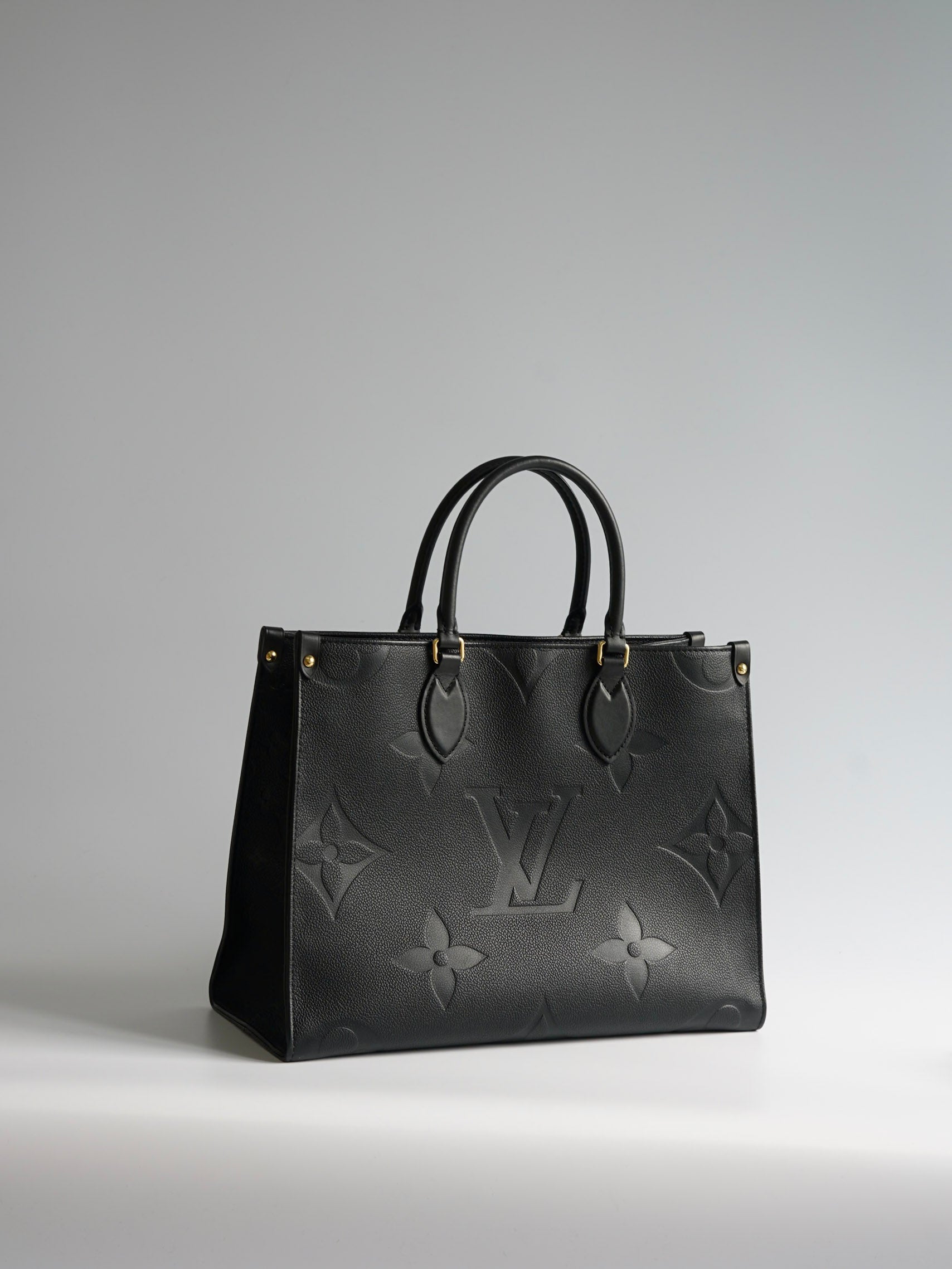On The Go MM (OTG) Black in Monogram Empreinte Leather (Microchip) | Purse Maison Luxury Bags Shop