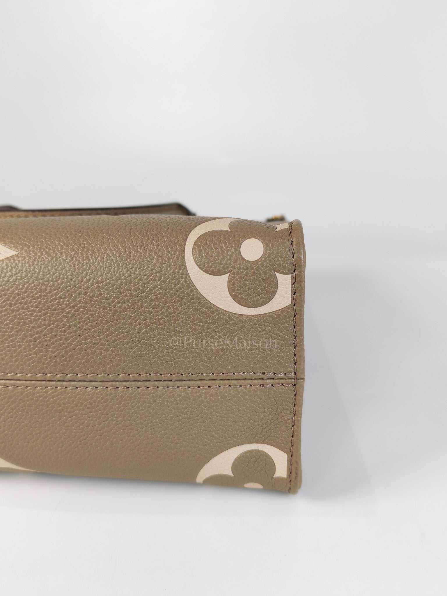 On The Go PM (OTG) in Tourterelle Creme in Monogram Empreinte Leather (Microchip) | Purse Maison Luxury Bags Shop