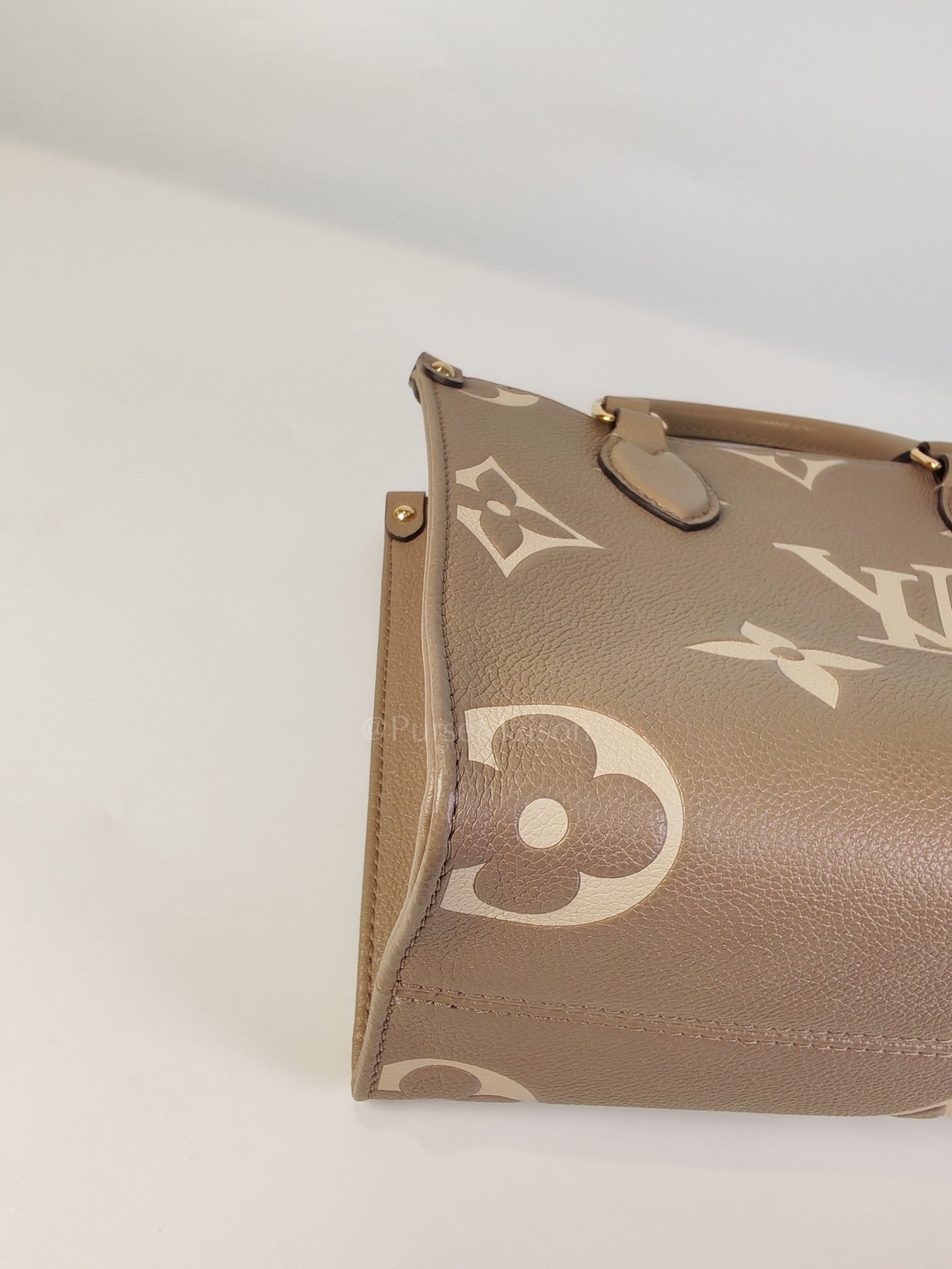 On The Go PM (OTG) in Tourterelle Creme in Monogram Empreinte Leather (Microchip) | Purse Maison Luxury Bags Shop