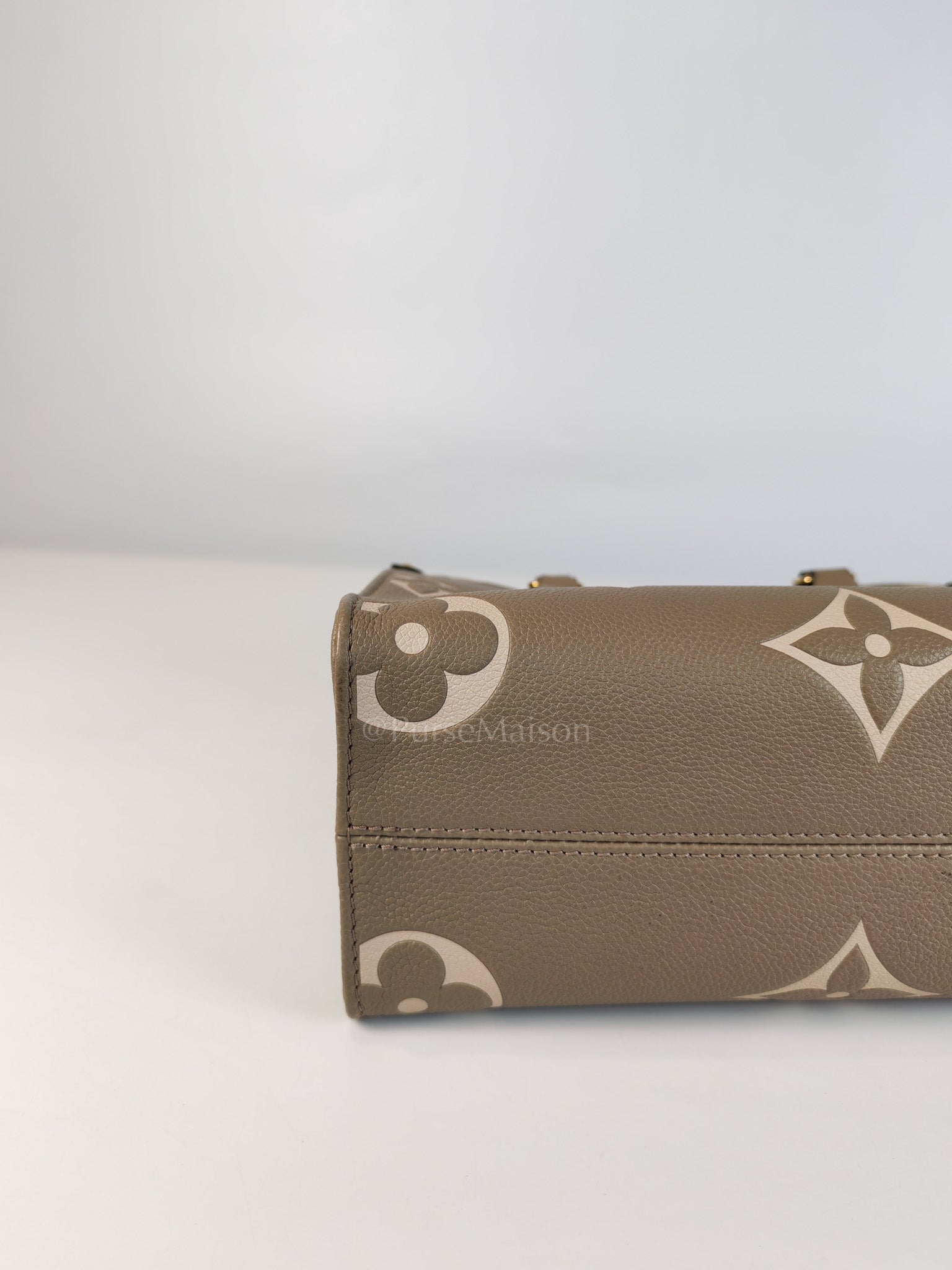 On The Go PM (OTG) in Tourterelle Creme in Monogram Empreinte Leather (Microchip) | Purse Maison Luxury Bags Shop