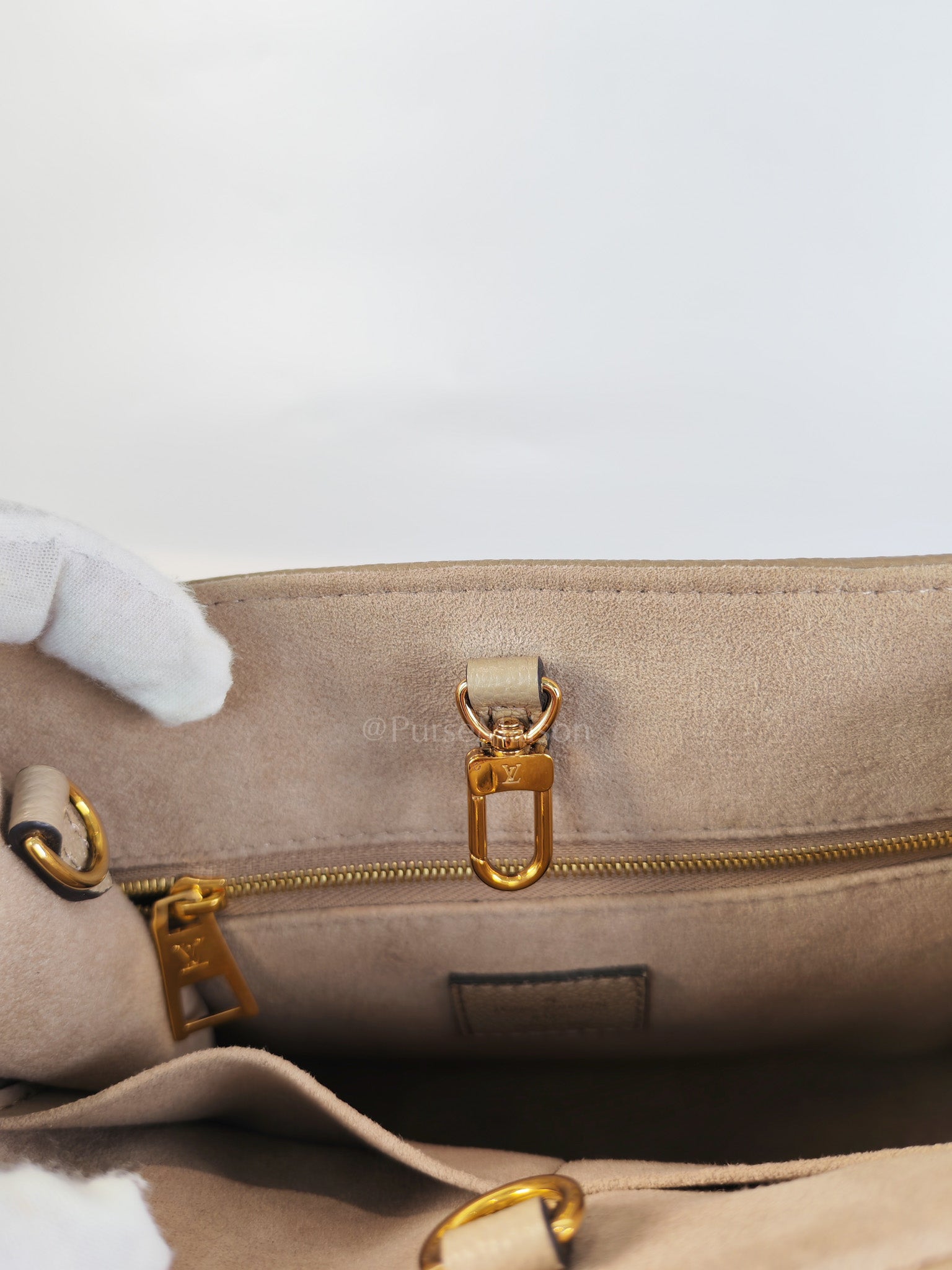On The Go PM (OTG) in Tourterelle Creme in Monogram Empreinte Leather (Microchip) | Purse Maison Luxury Bags Shop