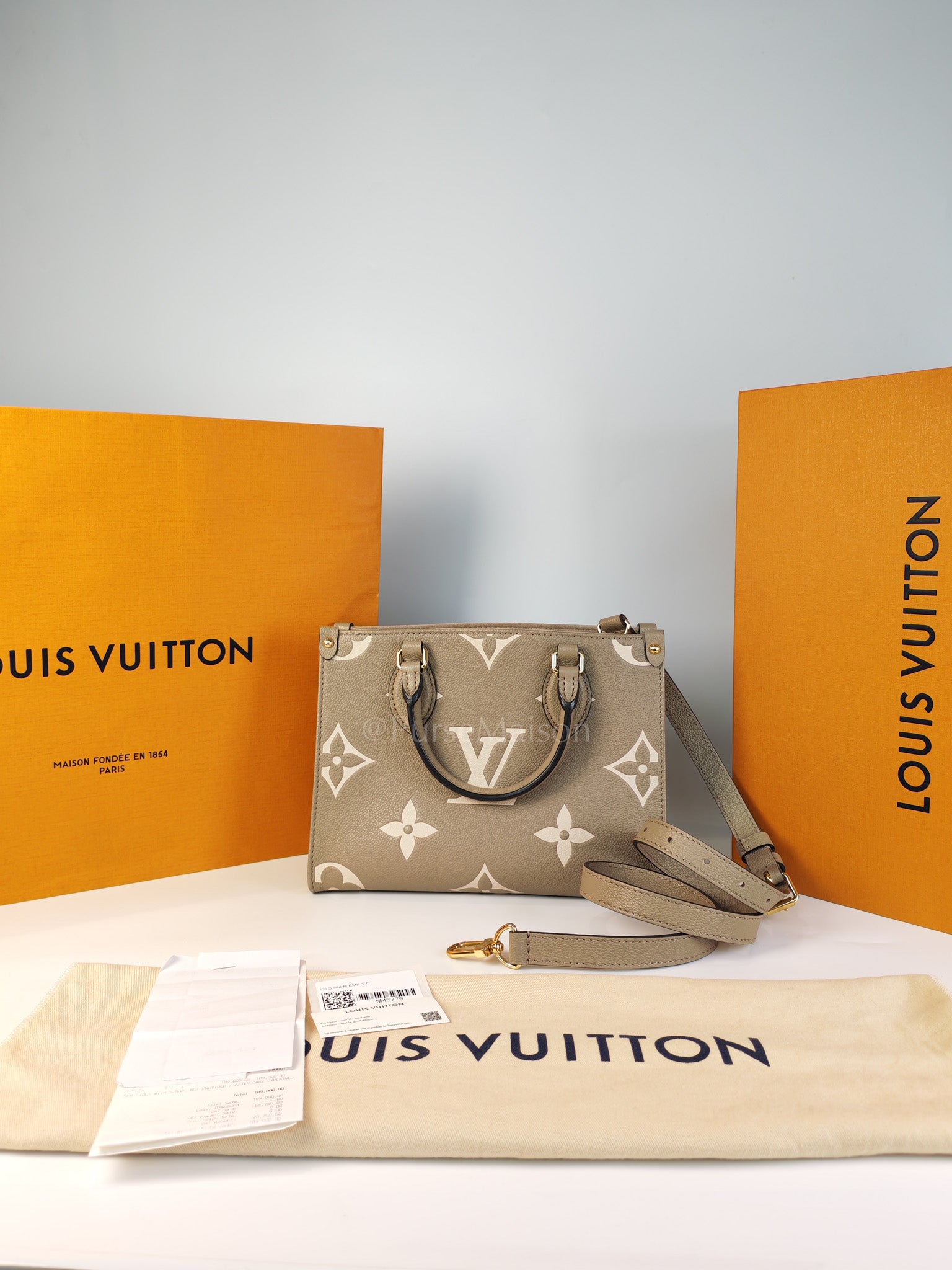 On The Go PM (OTG) in Tourterelle Creme in Monogram Empreinte Leather (Microchip) | Purse Maison Luxury Bags Shop