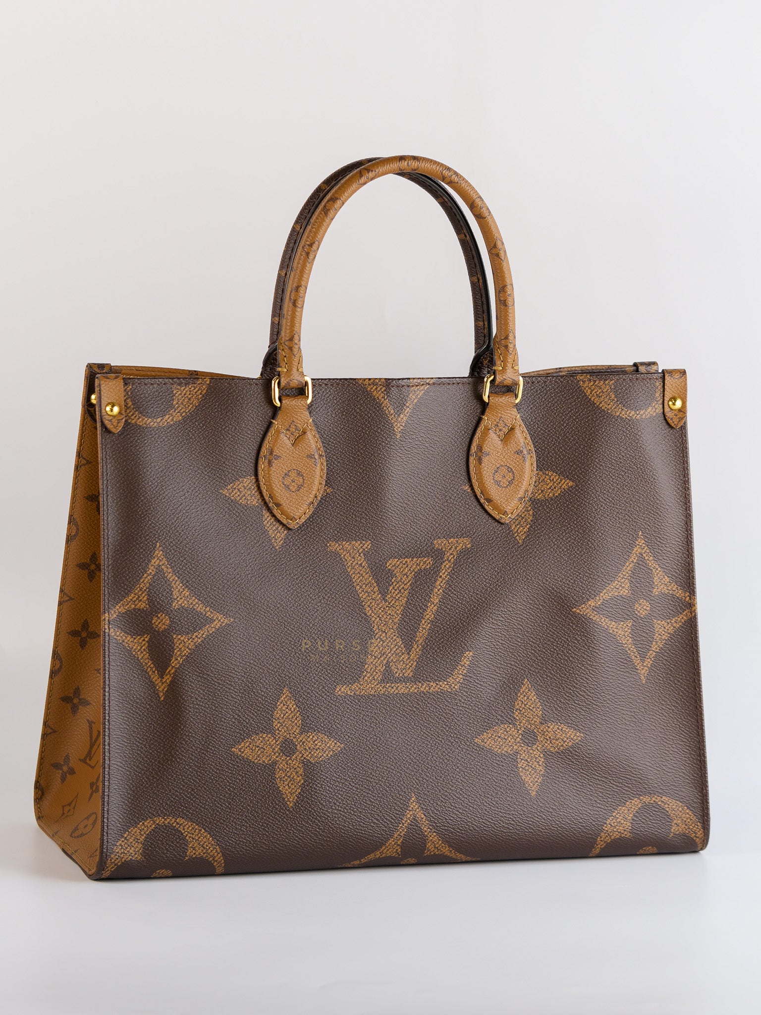 OnTheGo (OTG) MM in Reverse Monogram Canvas (Microchip) | Purse Maison Luxury Bags Shop