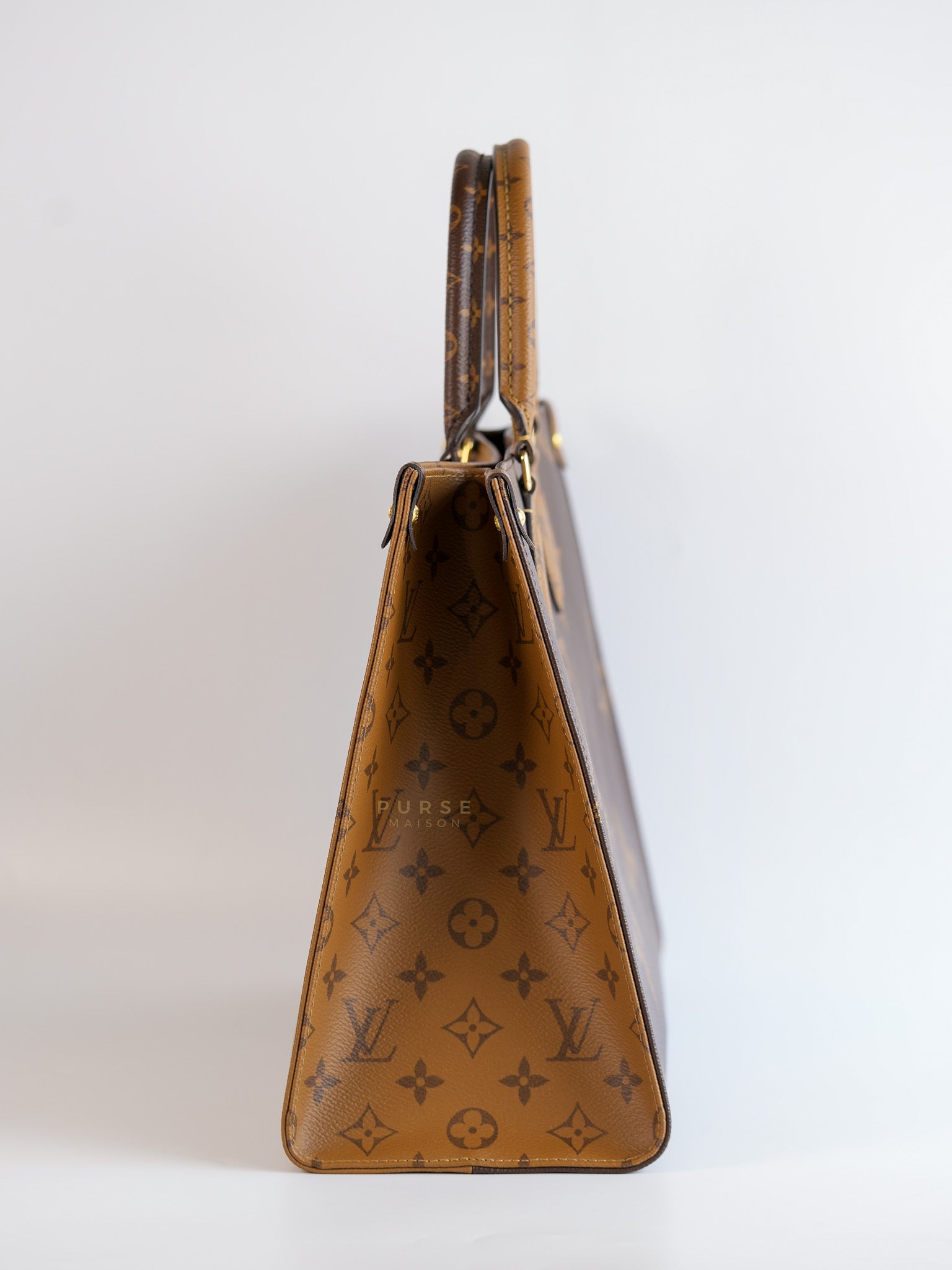 OnTheGo (OTG) MM in Reverse Monogram Canvas (Microchip) | Purse Maison Luxury Bags Shop