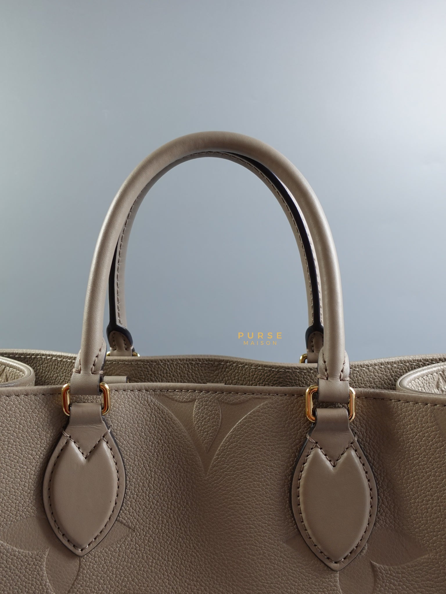 OnTheGo (OTG) MM Tourterelle Empreinte Monogram (Microchip) | Purse Maison Luxury Bags Shop