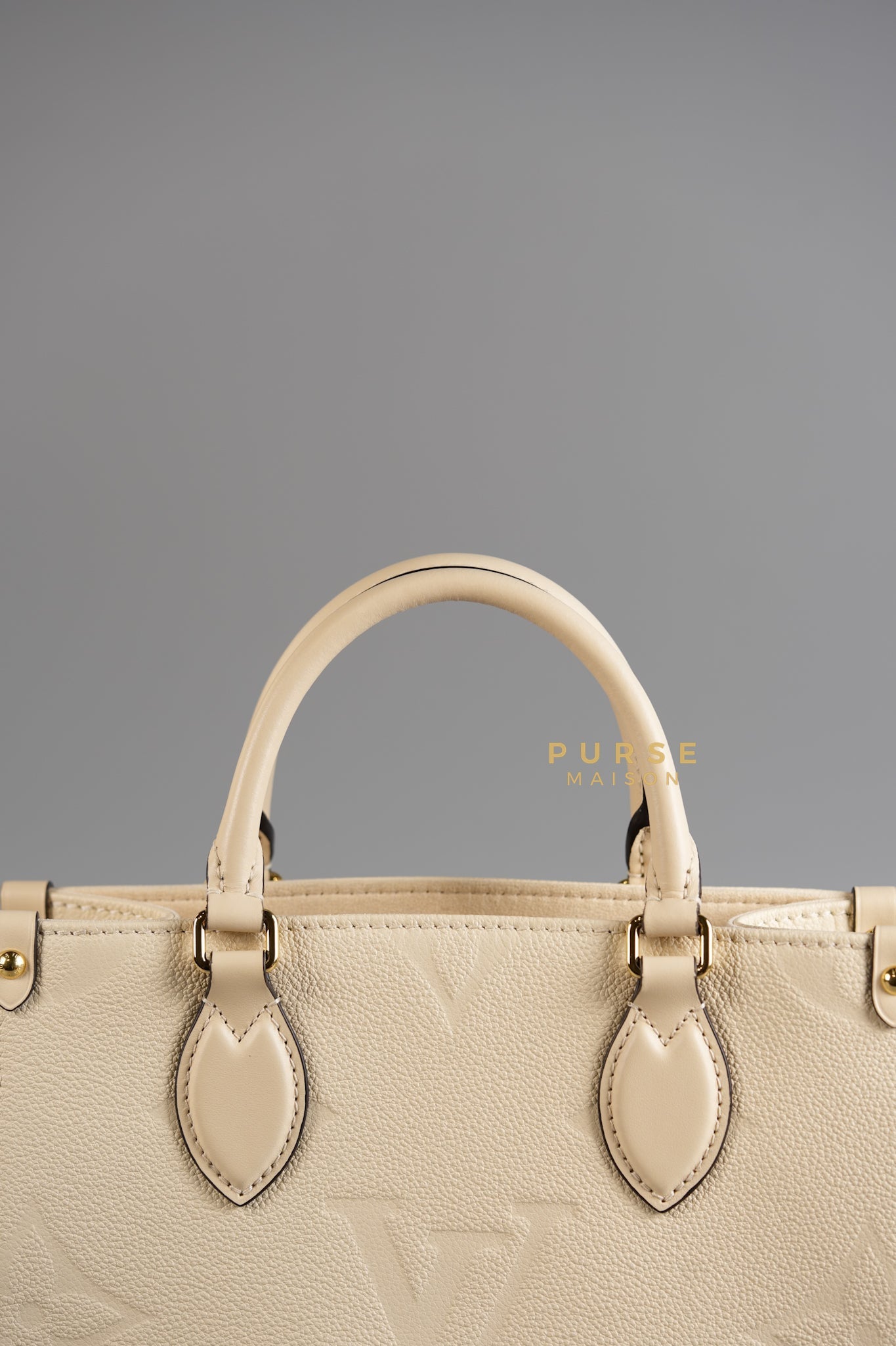 OnTheGo (OTG) PM Crème Empreinte Monogram (Microchip) | Purse Maison Luxury Bags Shop