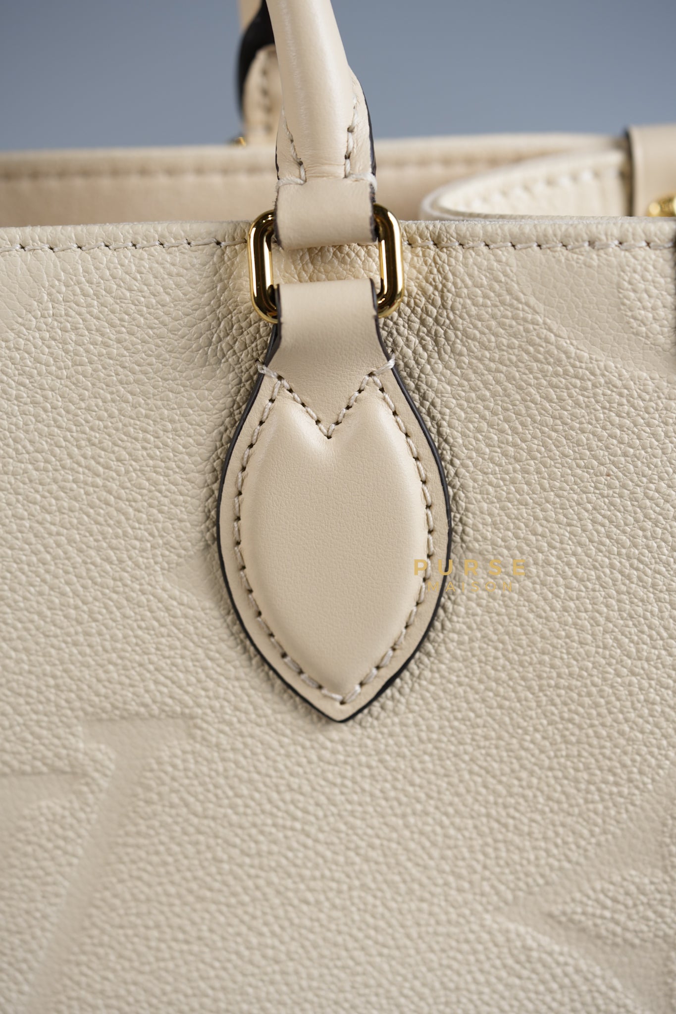 OnTheGo (OTG) PM Crème Empreinte Monogram (Microchip) | Purse Maison Luxury Bags Shop