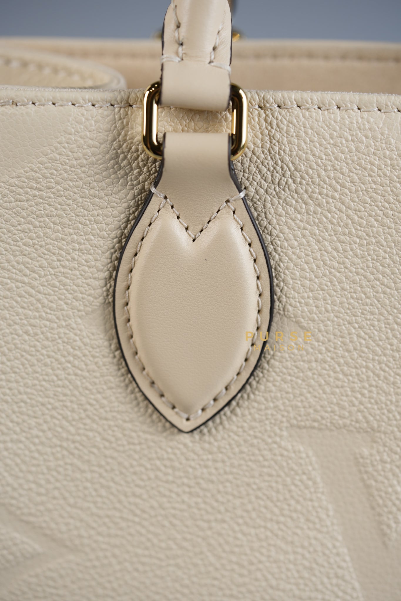 OnTheGo (OTG) PM Crème Empreinte Monogram (Microchip) | Purse Maison Luxury Bags Shop