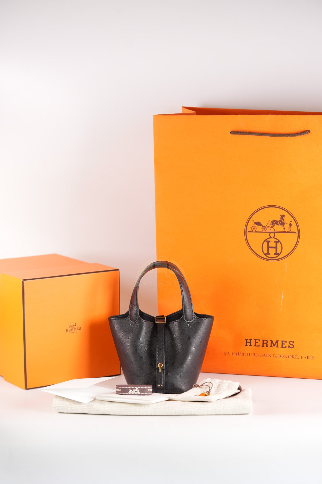 Picotin Micro in Black Ostrich Leather and Gold Hardware Stamp W (2024) | Purse Maison Luxury Bags Shop