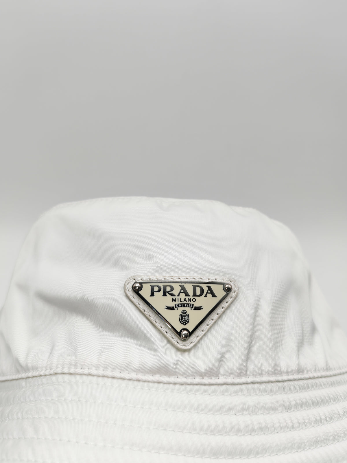 Prada Re-Nylon Bucket Hat in White with Signature Enameled Metal Triangle Logo | Purse Maison Luxury Bags Shop