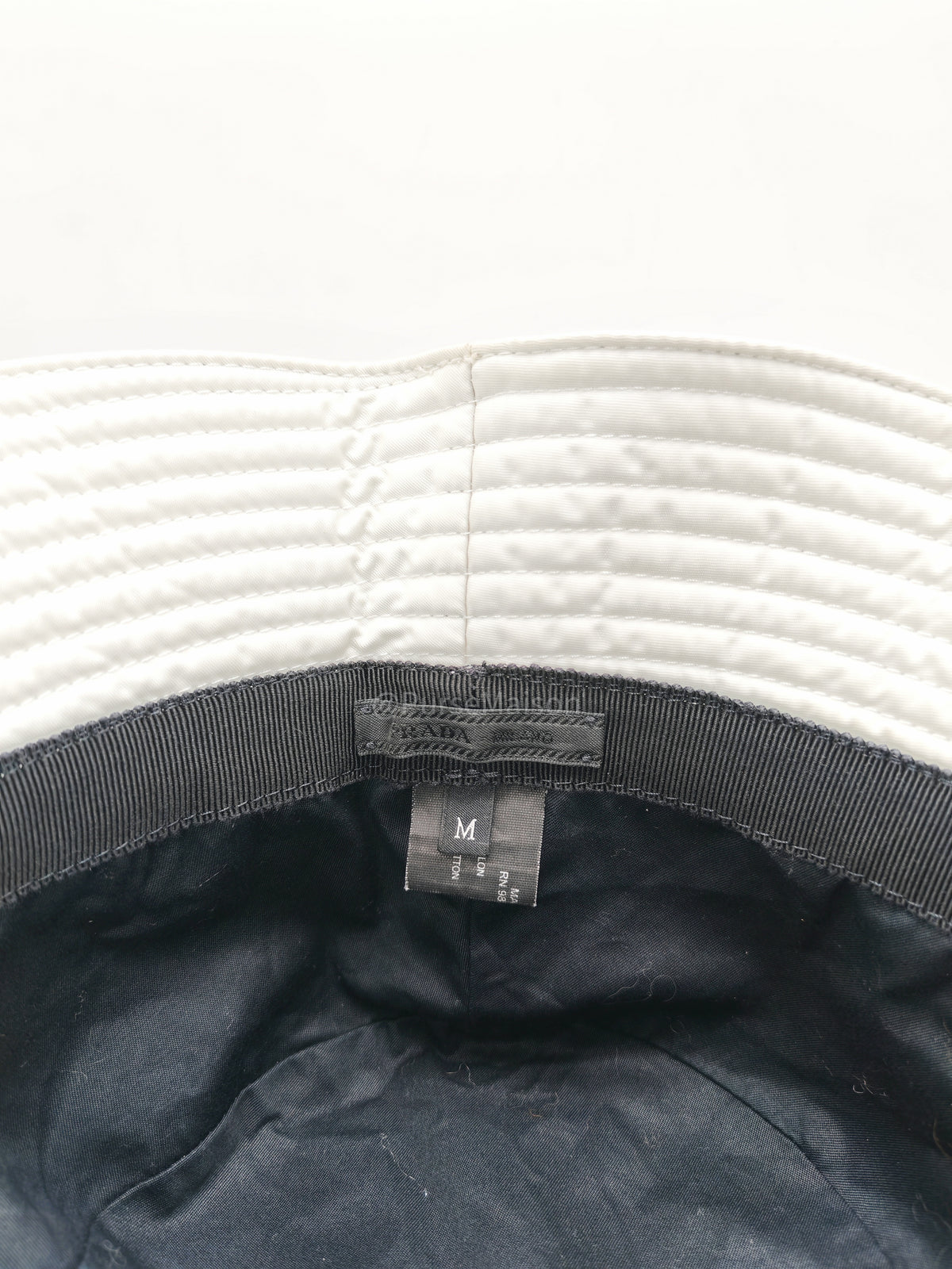 Prada Re-Nylon Bucket Hat in White with Signature Enameled Metal Triangle Logo | Purse Maison Luxury Bags Shop