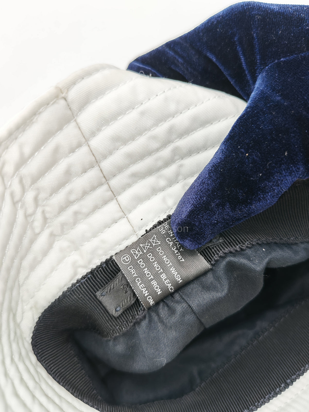 Prada Re-Nylon Bucket Hat in White with Signature Enameled Metal Triangle Logo | Purse Maison Luxury Bags Shop