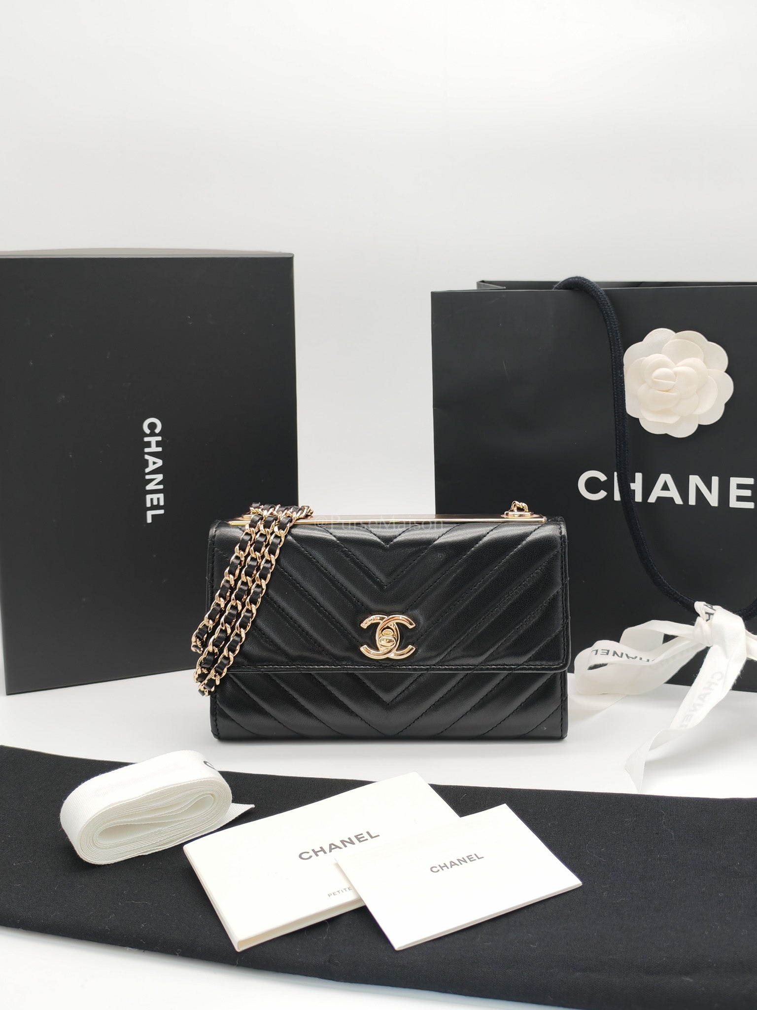 Trendy CC Wallet On Chain (WOC) in Black Chevron Lambskin Leather and Light Gold Hardware Series 25 | Purse Maison Luxury Bags Shop