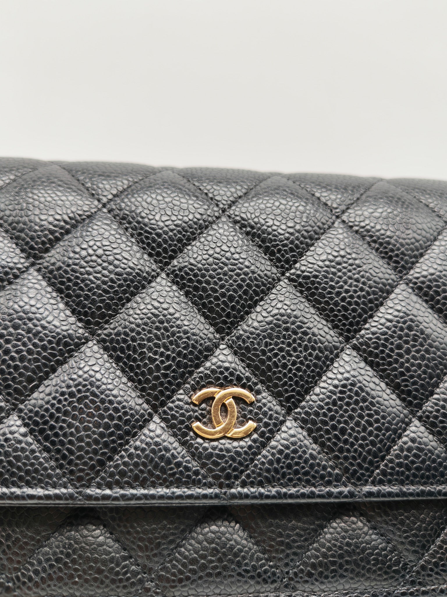 Wallet On Chain (WOC) in Black Quilted Caviar Leather and Gold Hardware Microchip